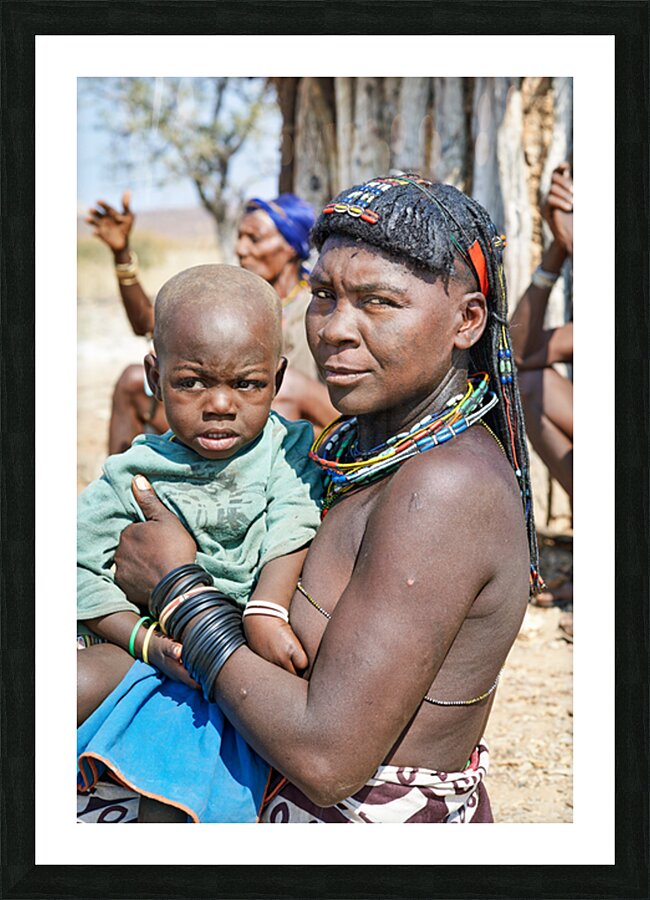 Portrait of young Zemba woman holding child in Kunene Region Picture Frame print