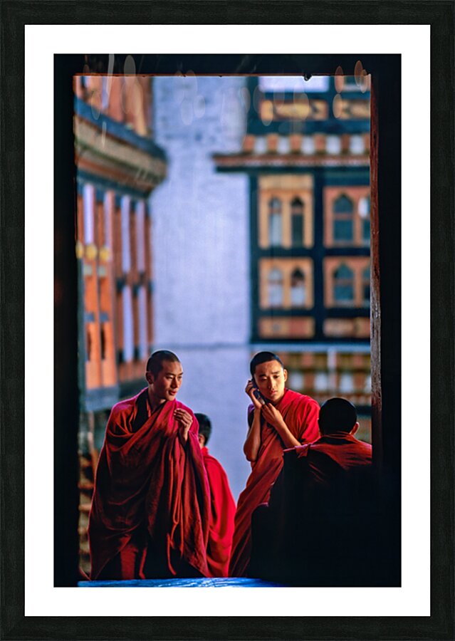 Bhutanese monks using a mobile phone. Picture Frame print