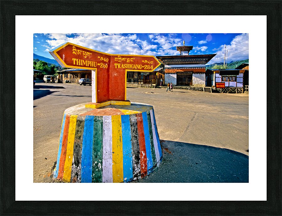Colorful Bhutanese signpost directs to Thimphu and Trashigang. Picture Frame print