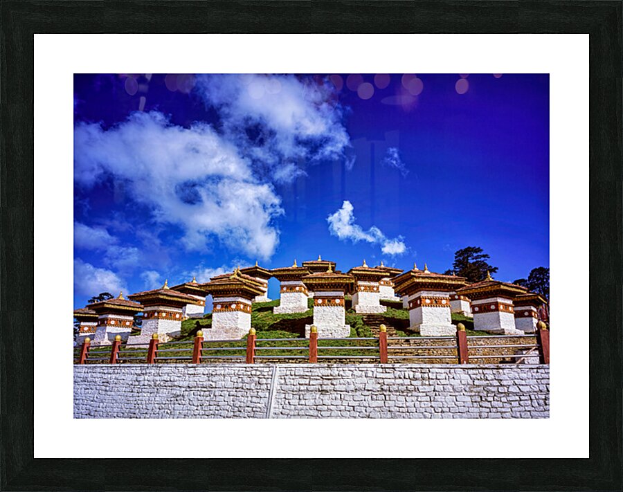 Traditional Bhutanese chortens on a green hill blue sky. Picture Frame print