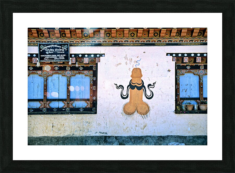 Phallus painting on a building wall with windows and shop sign. Picture Frame print