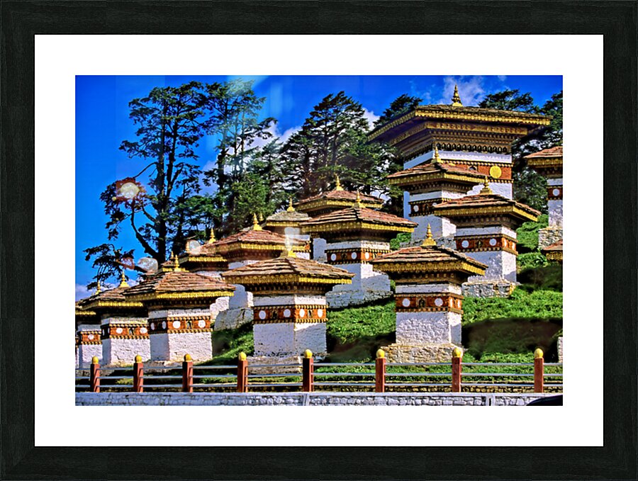 Druk Wangyal Chortens Bhutan with lush trees and blue sky. Picture Frame print