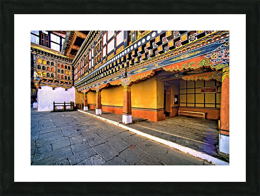 Vibrant ornate Bhutanese temple architecture and stone courtyar Picture Frame print