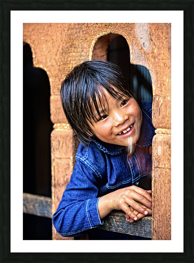 Smiling child peeking from a wooden window. Picture Frame print