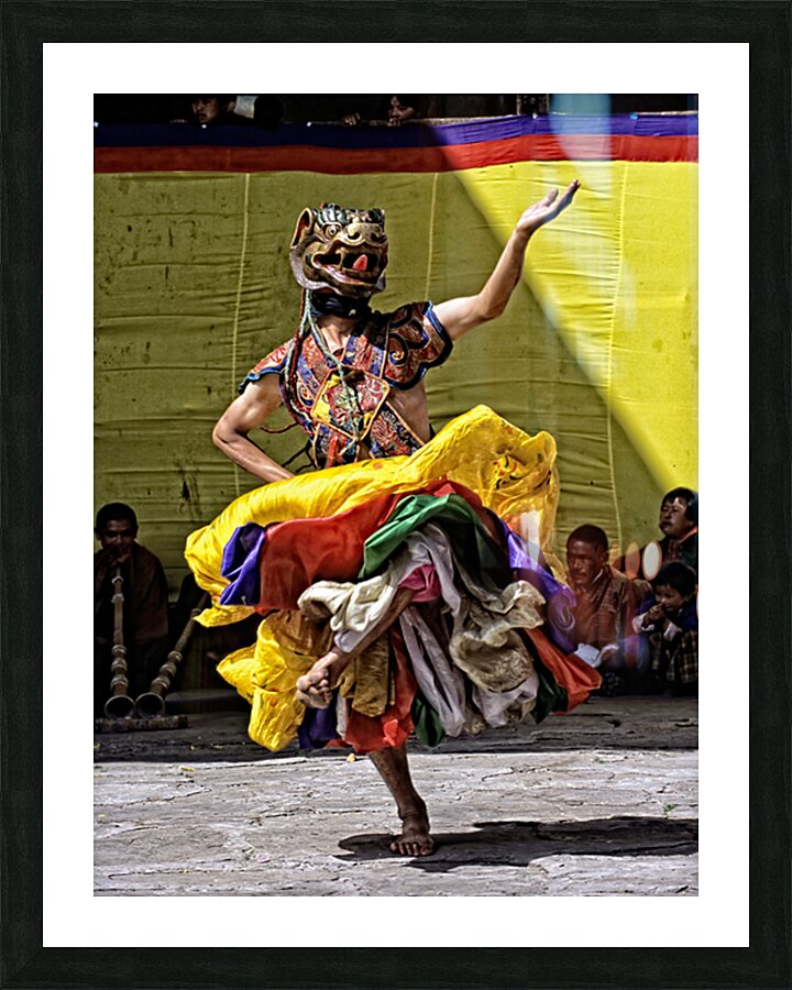Vibrant masked dancer performs traditional dance. Picture Frame print