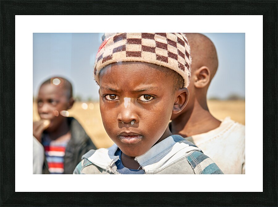 Portrait of a boy in Kavango Region Namibia during the day Picture Frame print