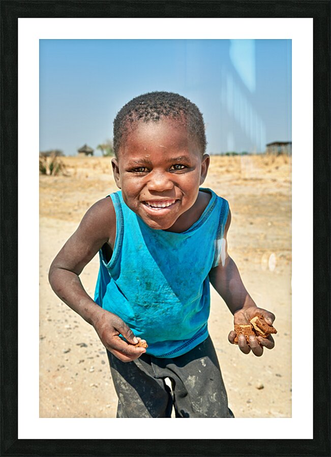Joyful boy in Kavango Region of Namibia enjoys a moment outside Picture Frame print