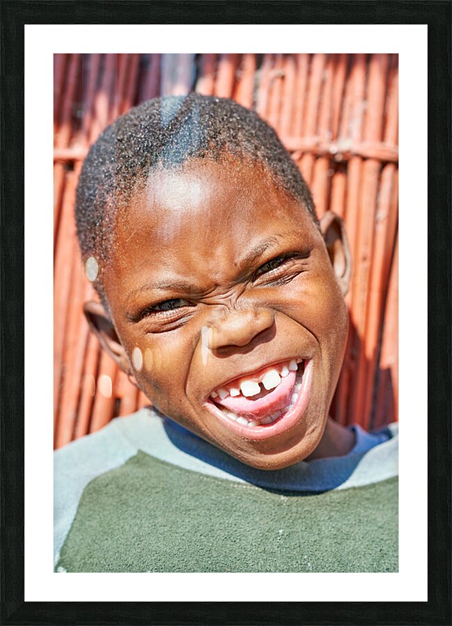 Joyful child smiles in Kavango Region of Namibia Picture Frame print