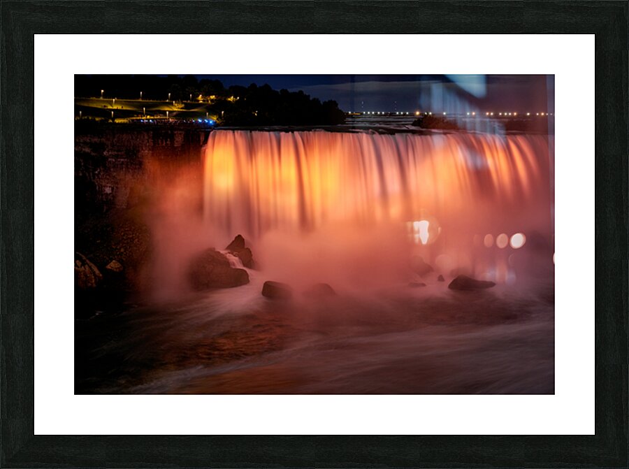 Niagara Falls illuminated orange at night. Picture Frame print