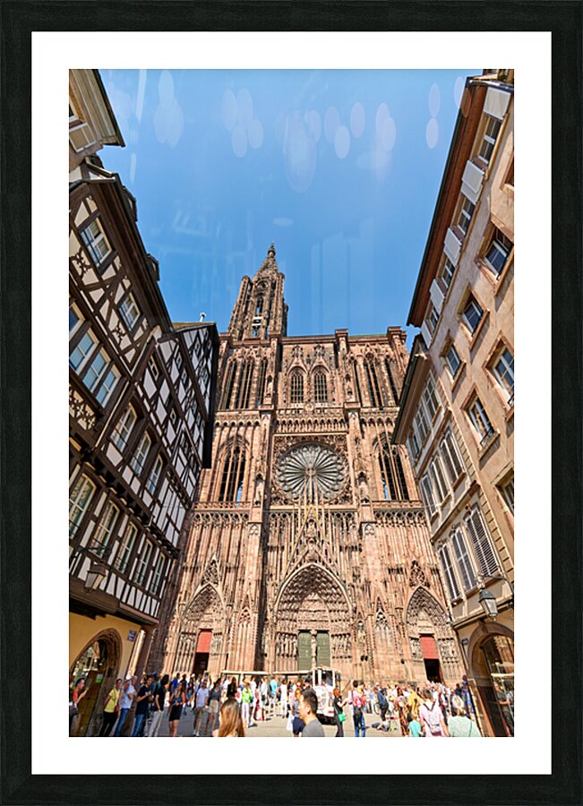 Tourists gather at Strasbourg Cathedral in Alsace on a sunny day Picture Frame print