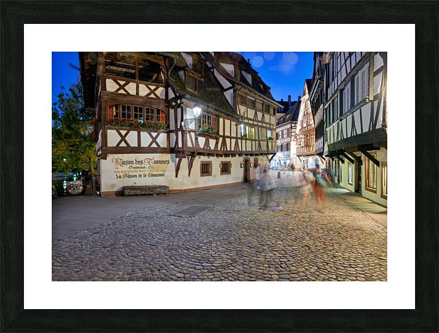 Colorful timber houses and people walking in Strasbourg at night Picture Frame print