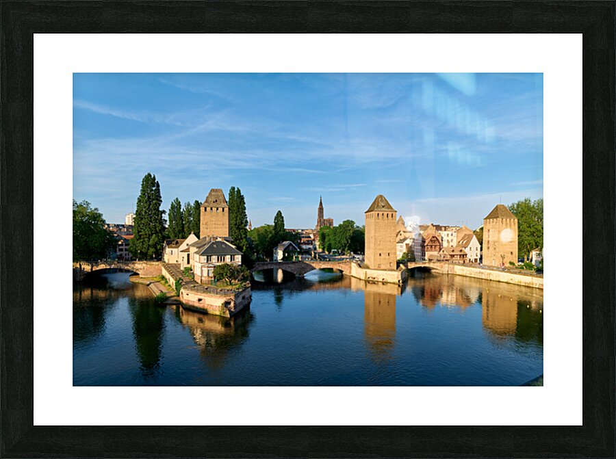 Covered bridges in Strasbourg by the river on a clear day Picture Frame print