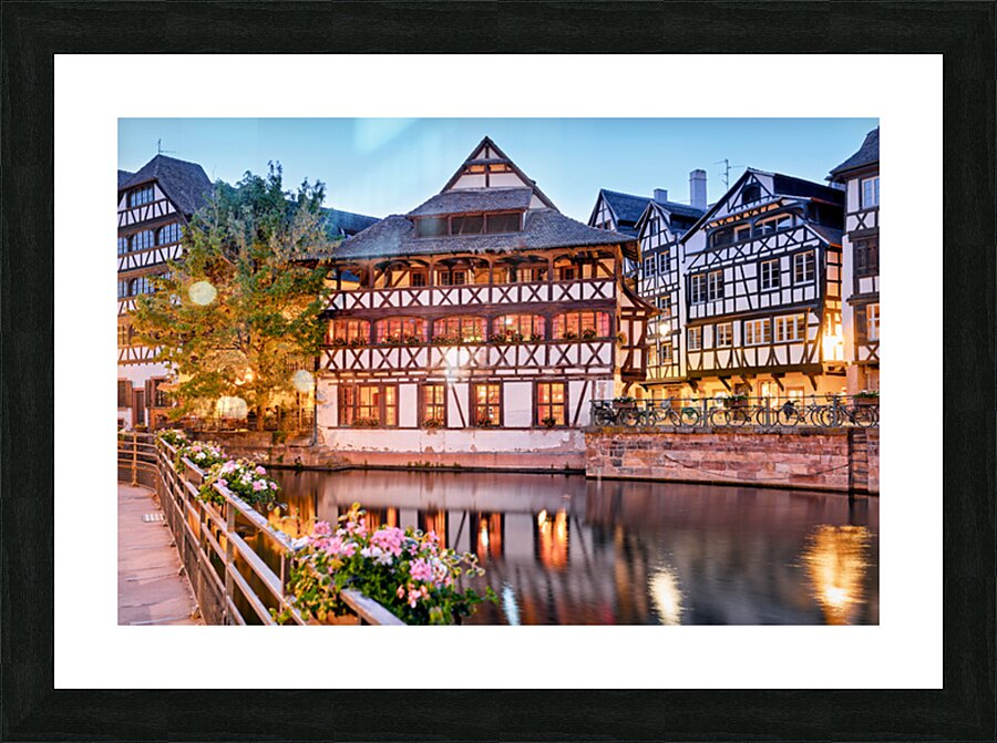 Timber houses in Petit France district by the water in Strasbour Picture Frame print