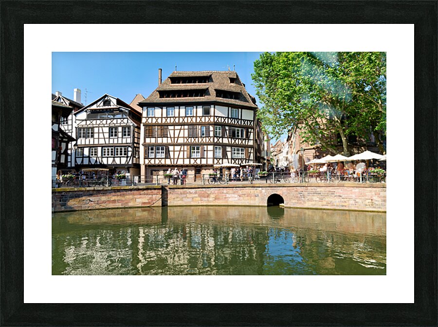 Colored timber houses by the water in Petit France district Picture Frame print