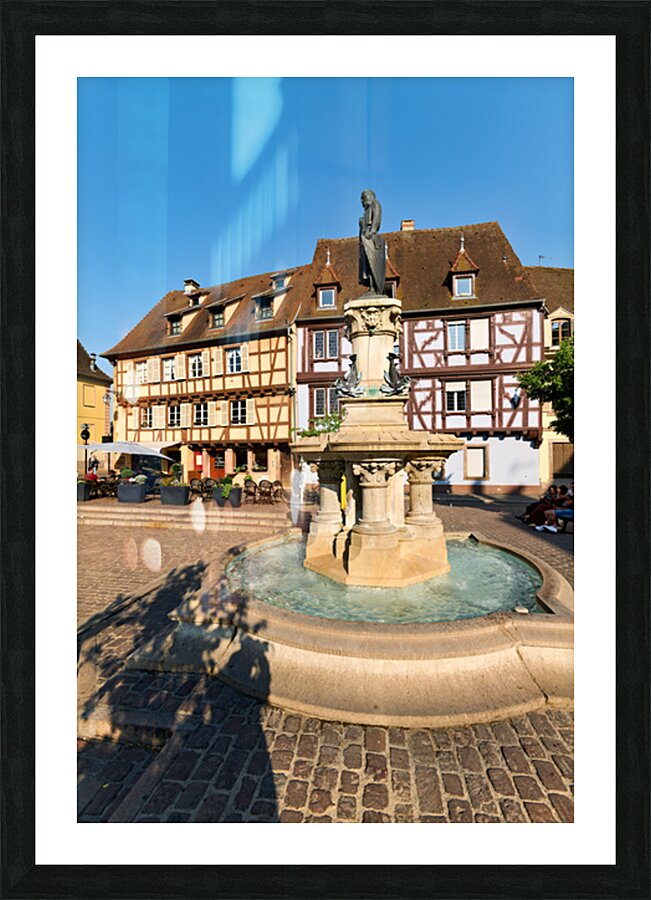 Timber framed houses and fountain in Petite Venise Colmar France Picture Frame print