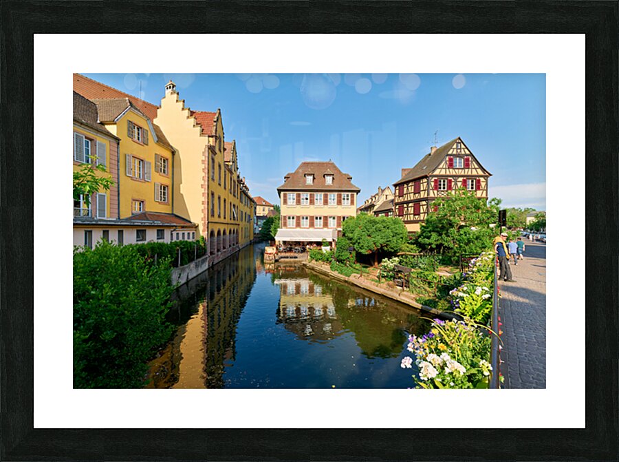Visitors enjoy sunny day by canals in Colmar France Picture Frame print