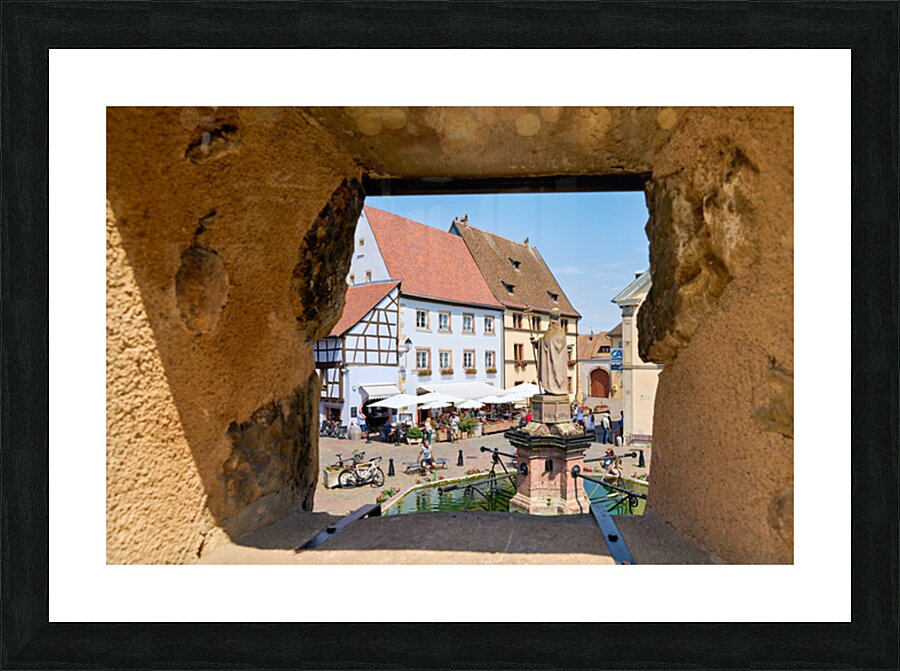 Visitors enjoy Saint Leon square in Eguisheim Alsace on wine rou Picture Frame print