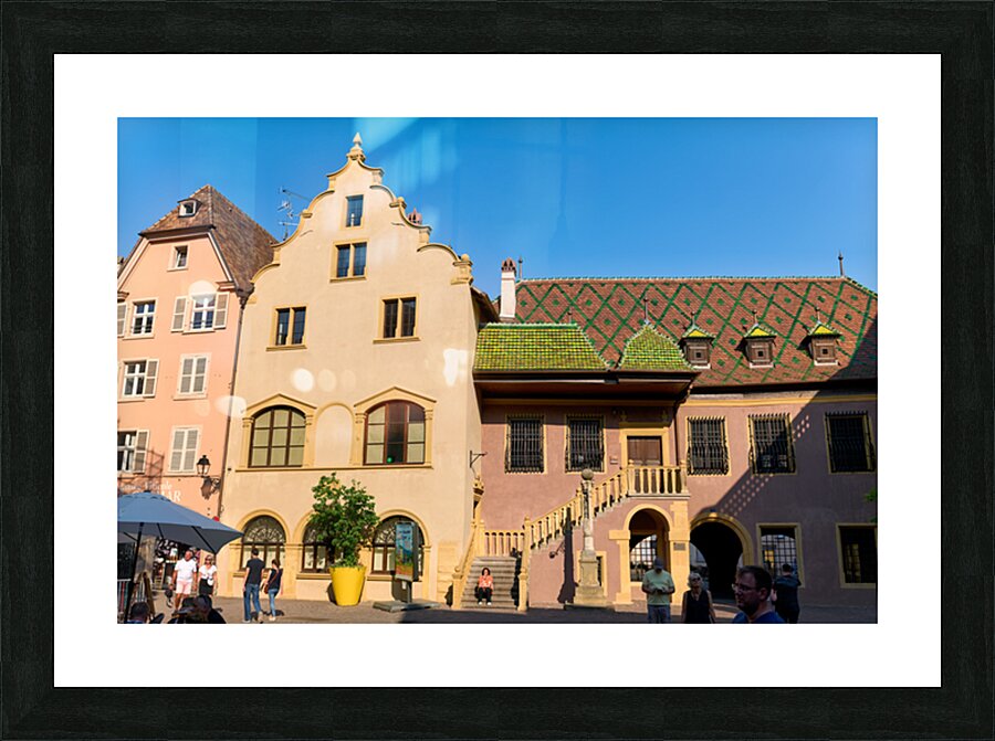 Visitors gather at Koifhus old custom house in Colmar Alsace Picture Frame print