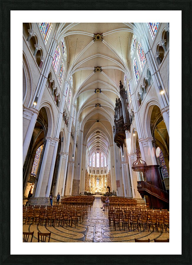 Chartres Cathedral inside with tall arches and wooden chairs Picture Frame print
