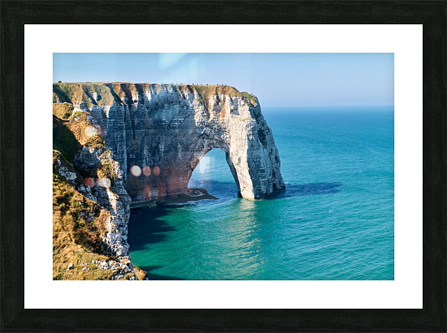 Chalk cliffs of Etretat along the coast of Normandy in France Picture Frame print