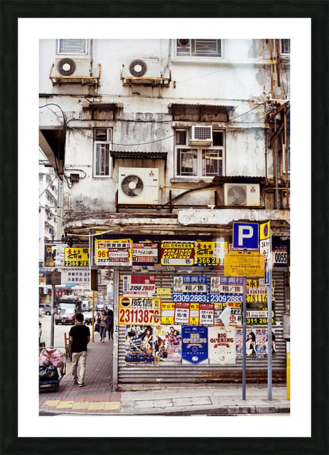 Busy street in Hong Kong shows old building and pedestrians Picture Frame print