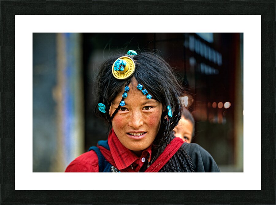 Traditional woman carries child in Tibet with ornate hair decora Picture Frame print