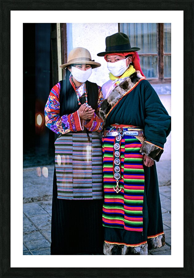 Masked individuals in traditional clothing hold hands in Tibet Picture Frame print