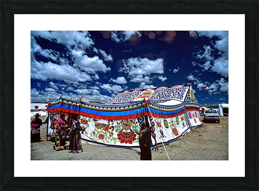 Colorful Tibetan tent with people under a cloudy sky in Tibet Picture Frame print