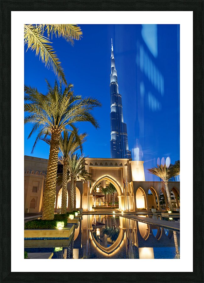 Burj Khalifa stands tall at night with light reflections in Duba Picture Frame print