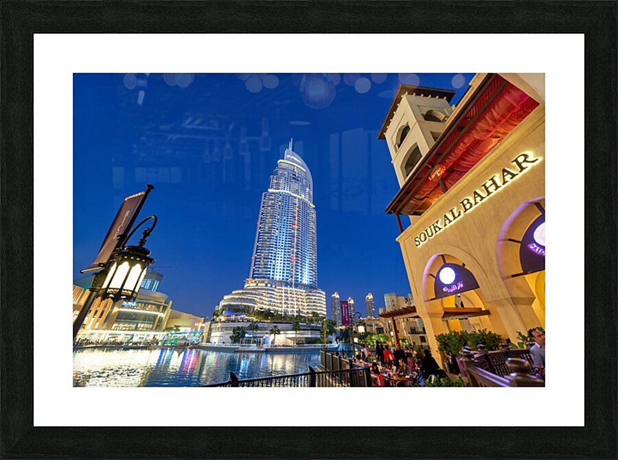 Night lights and waterfront dining in Dubai cityscape Picture Frame print