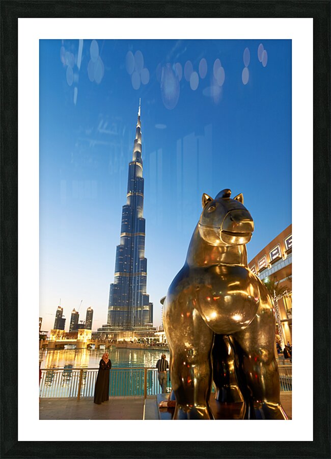 Burj Khalifa and golden horse statue at dusk in Dubai Picture Frame print