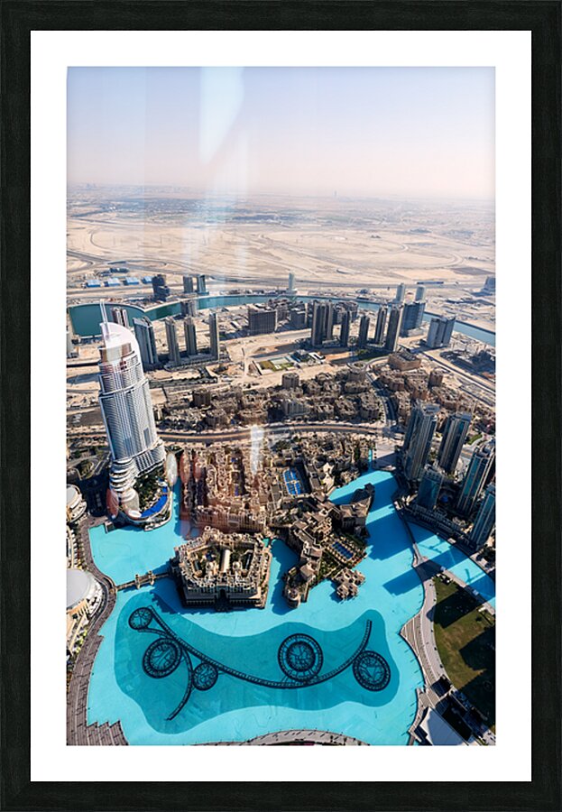 Dubai cityscape shows buildings water and desert from above Picture Frame print