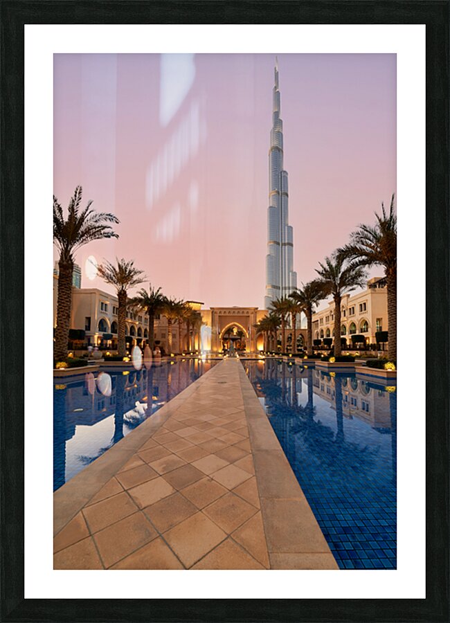 Burj Khalifa towers over pool and traditional buildings in Dubai Picture Frame print
