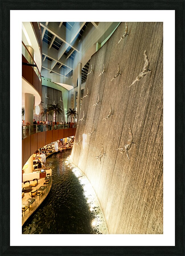 Indoor waterfall with diving sculptures and dining in Dubai UAE Picture Frame print