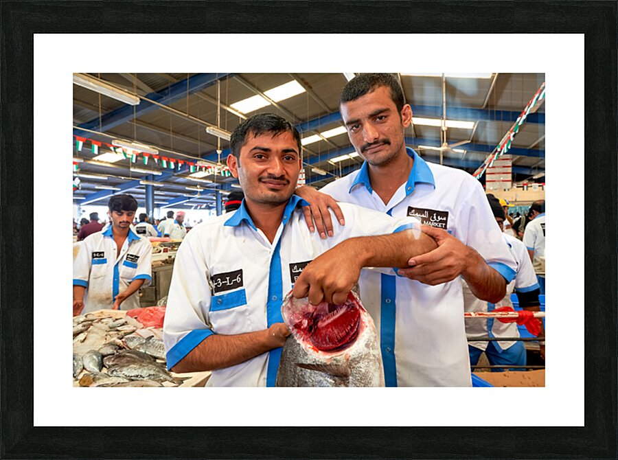 Fishmongers show fresh catch at market in Dubai UAE Picture Frame print