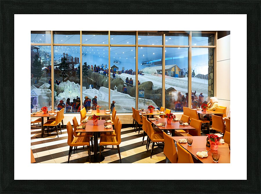Restaurant offers view of snow activities at indoor park in Duba Picture Frame print