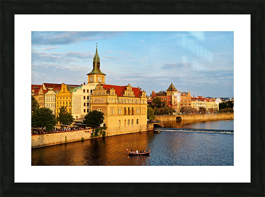 Sunset over Pragues Vltava River historic buildings and boat. Picture Frame print