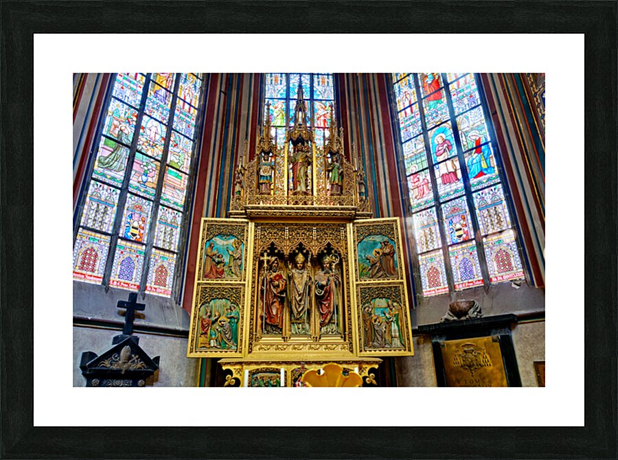 Ornate golden altarpiece and vibrant stained glass windows in a  Picture Frame print