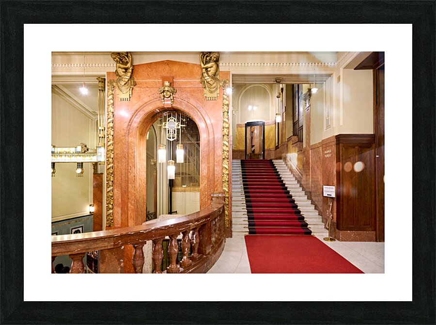 Elegant interior with red carpeted staircase and ornate gold det Picture Frame print