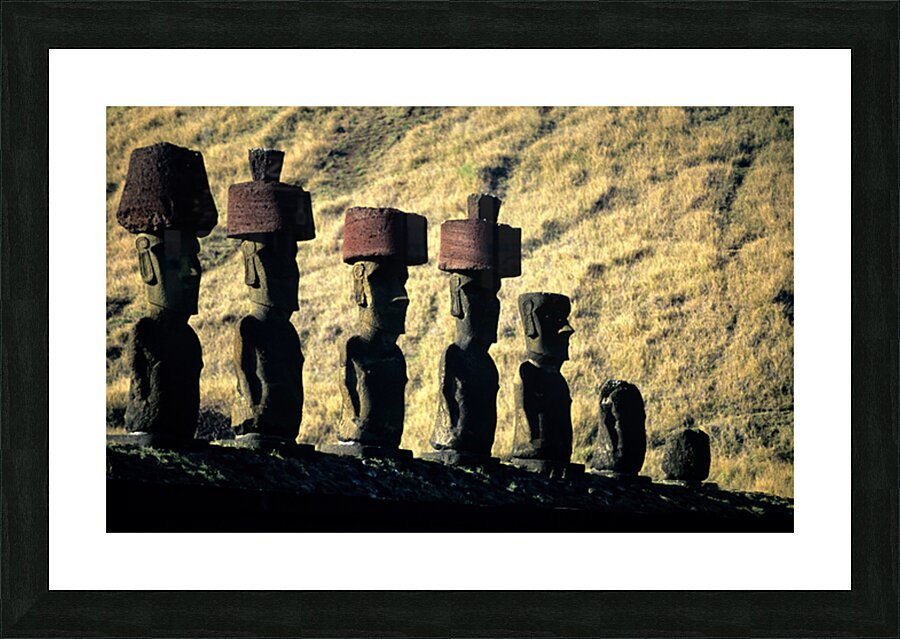 Easter Island Moai statues with red hats on a hillside. Picture Frame print