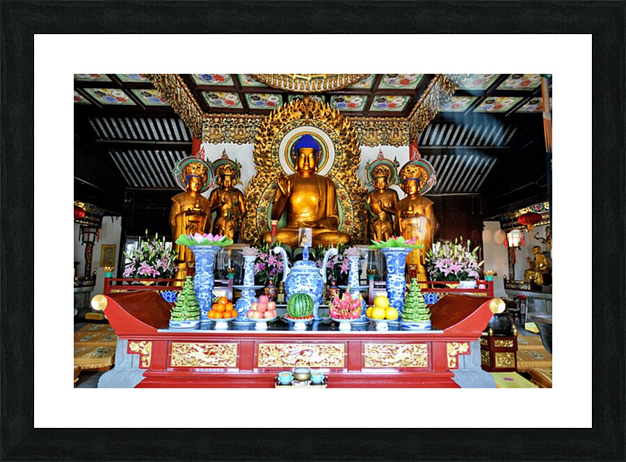 Visitors observe golden statues in Shanghai Buddhist temple inte Picture Frame print