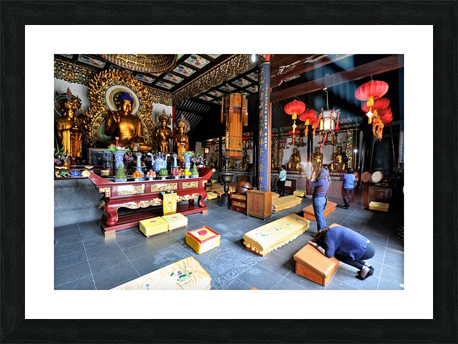 Worshippers offer prayers in a Buddhist temple in Shanghai Chin Picture Frame print