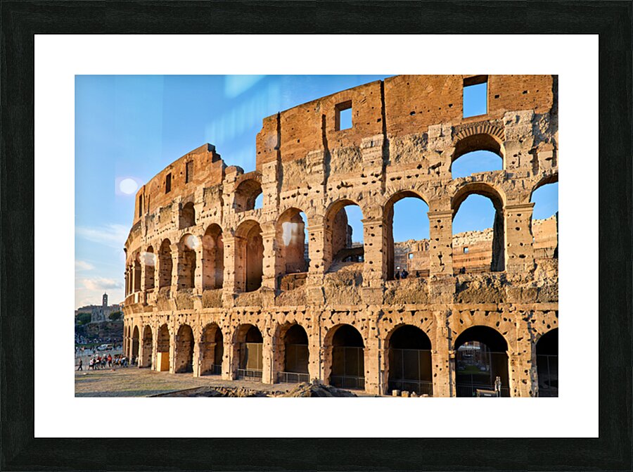 Colosseum stands tall in Rome during golden hour Picture Frame print