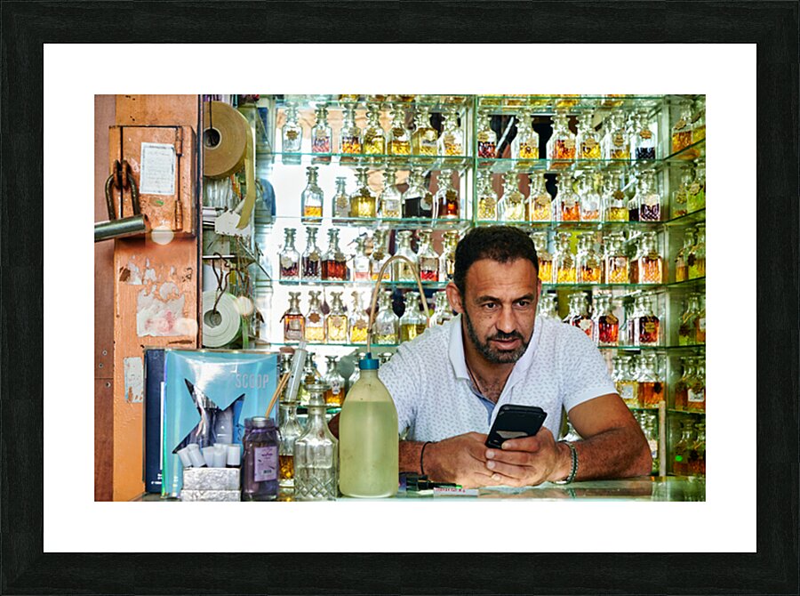 Man working in a perfumery in the old city of Jerusalem Picture Frame print