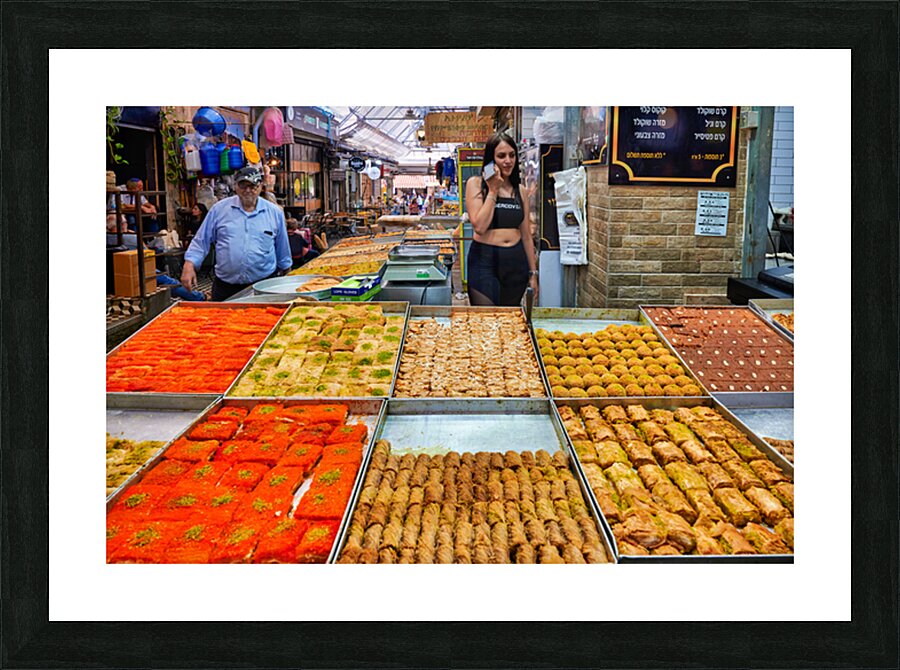 Visitors explore food stands at Mahane Yehuda Market in Jerusale Picture Frame print
