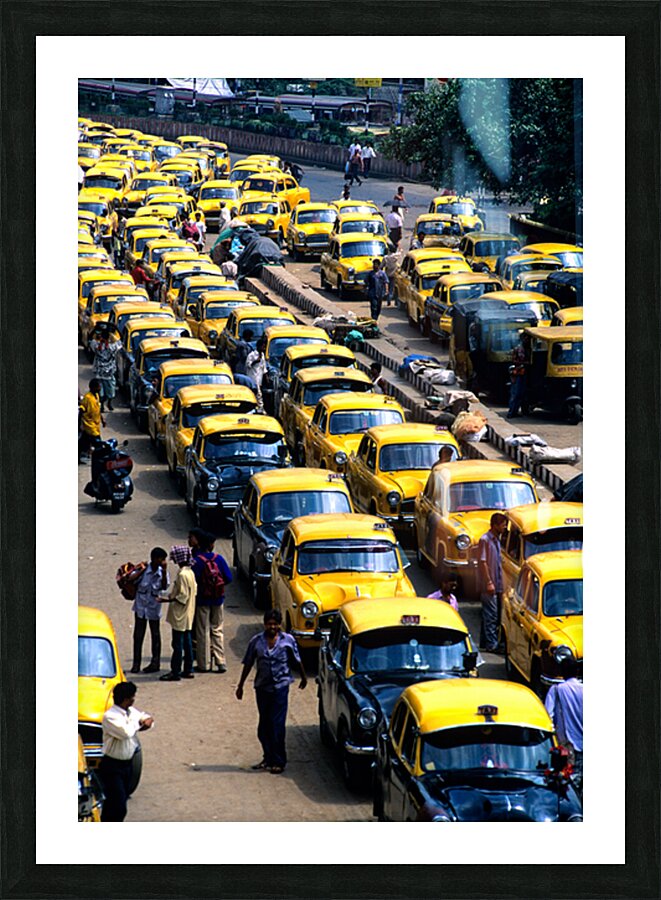 Taxi parking in Kolkatas busy streets during daytime Picture Frame print
