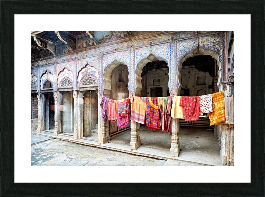 Decorated painted houses and colorful clothes in Mandawa Rajasth Picture Frame print