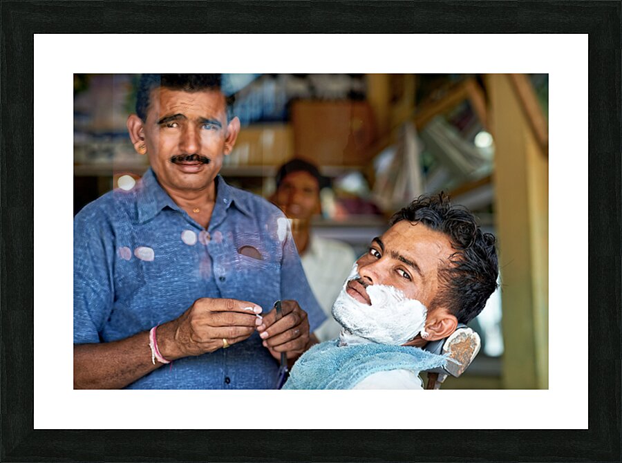 Barber at work in Khimsar Rajasthan India during a busy day Picture Frame print