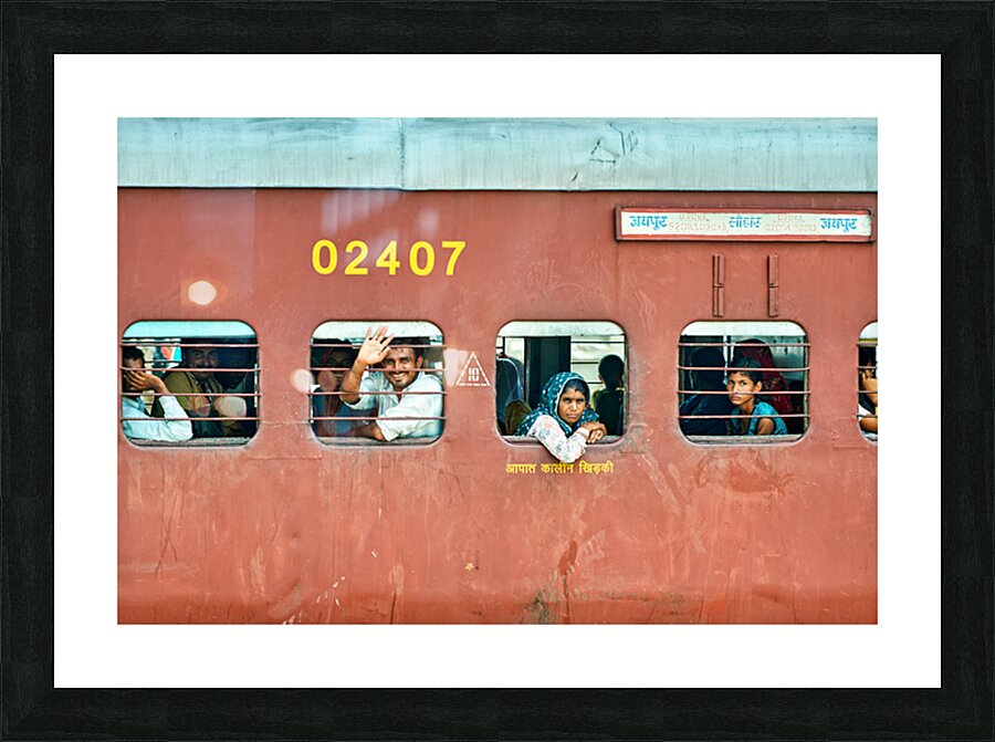 People travel on a train in Rajasthan India during the day Picture Frame print