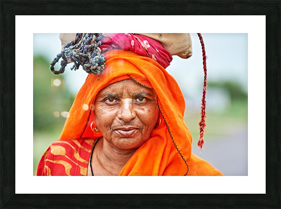 Portrait of an old woman in Rajasthan India wearing bright clot Picture Frame print
